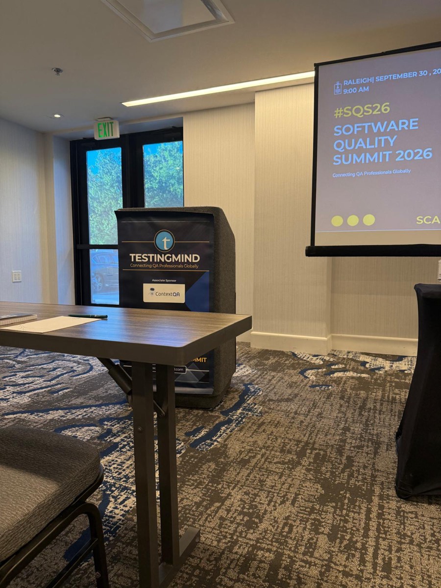 Photo: the summit room before doors opened, #SQS26 on the screen